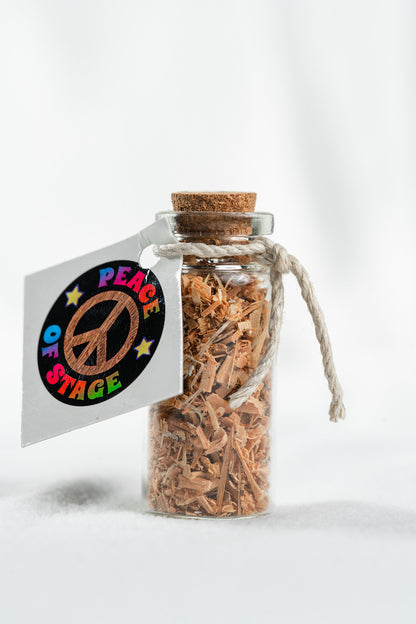 Glass Bottle Filled with shavings and stardust from the original 1969 Woodstock stage wood- Peace Of Stage LLC- {{Product type}}