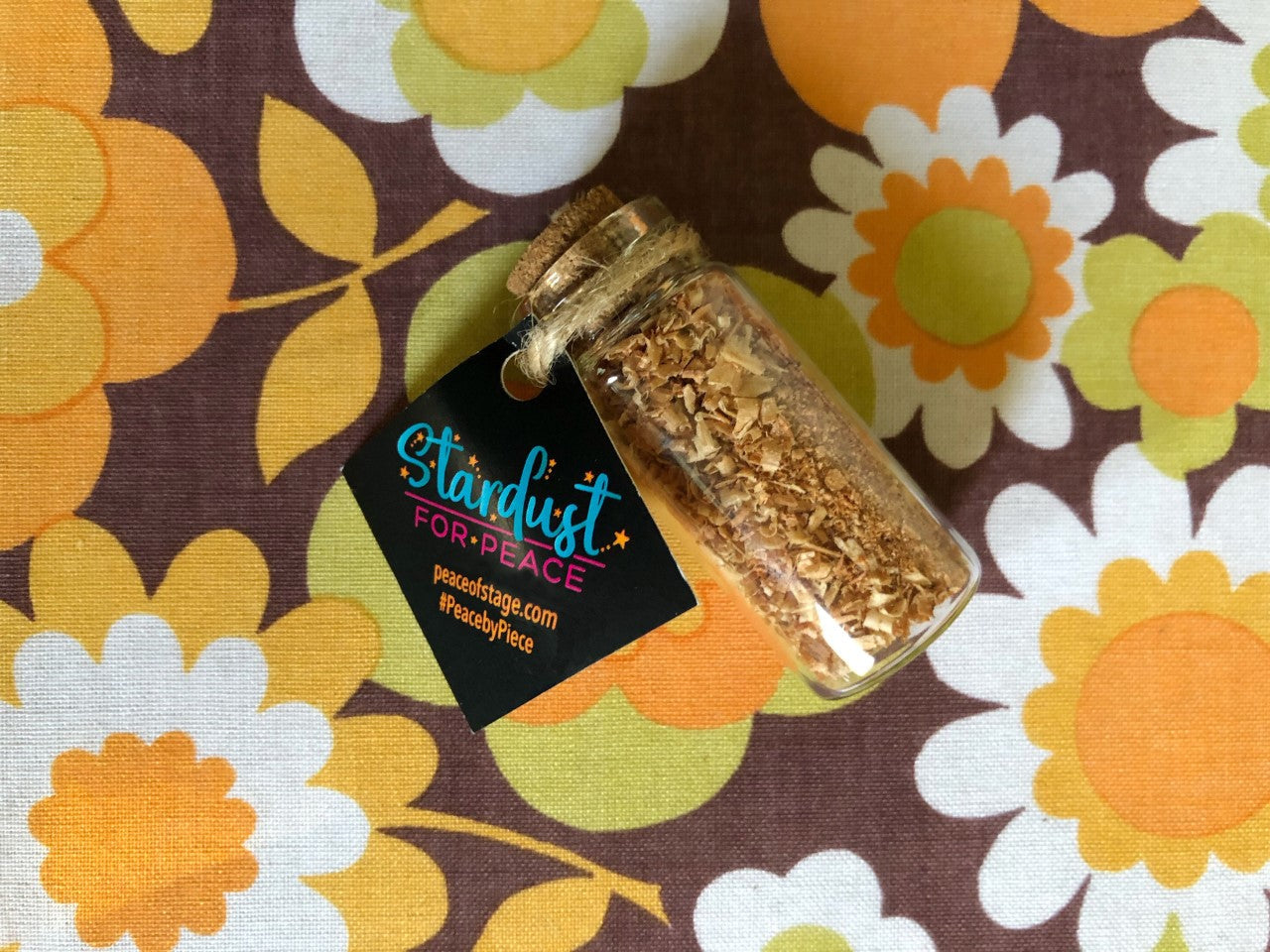 Glass Bottle Filled with shavings and stardust from the original 1969 Woodstock stage wood- Peace Of Stage LLC- {{Product type}}