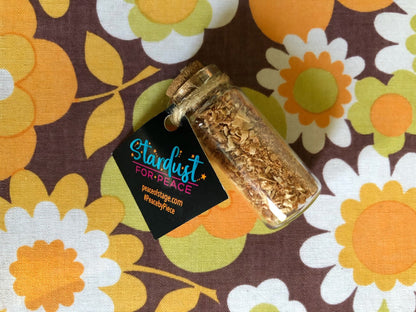 Glass Bottle Filled with shavings and stardust from the original 1969 Woodstock stage wood- Peace Of Stage LLC- {{Product type}}